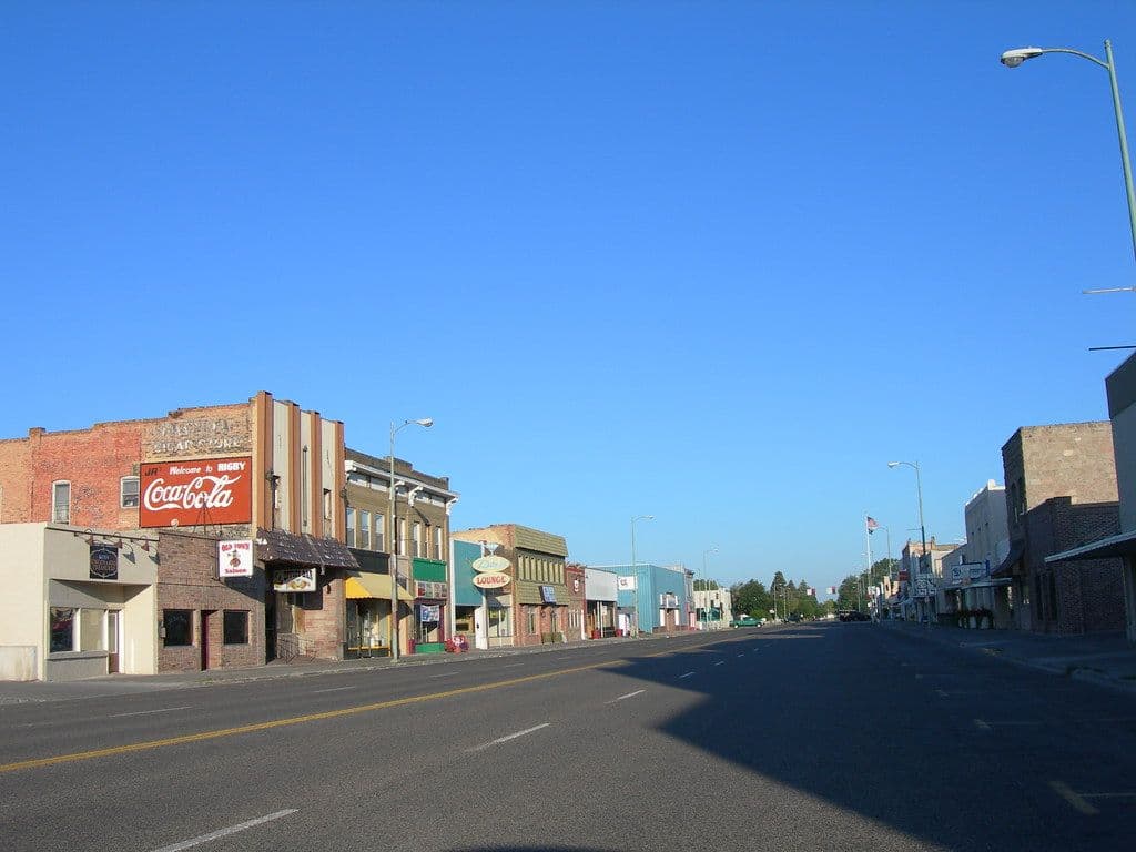 rigby idaho downtown with wide road and historic building on either side