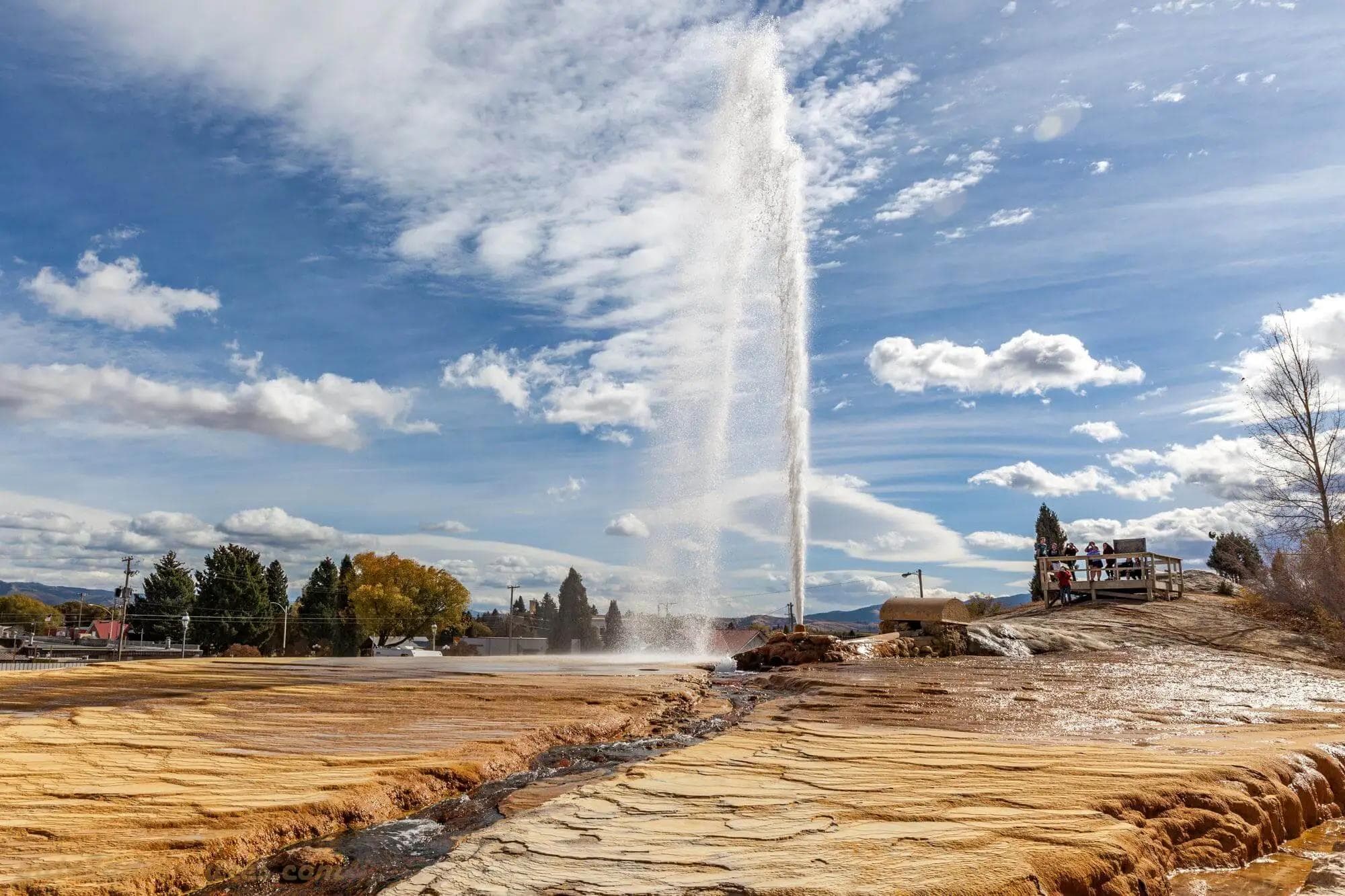 soda springs geyser shooting up high into the air as onlookers snap photos