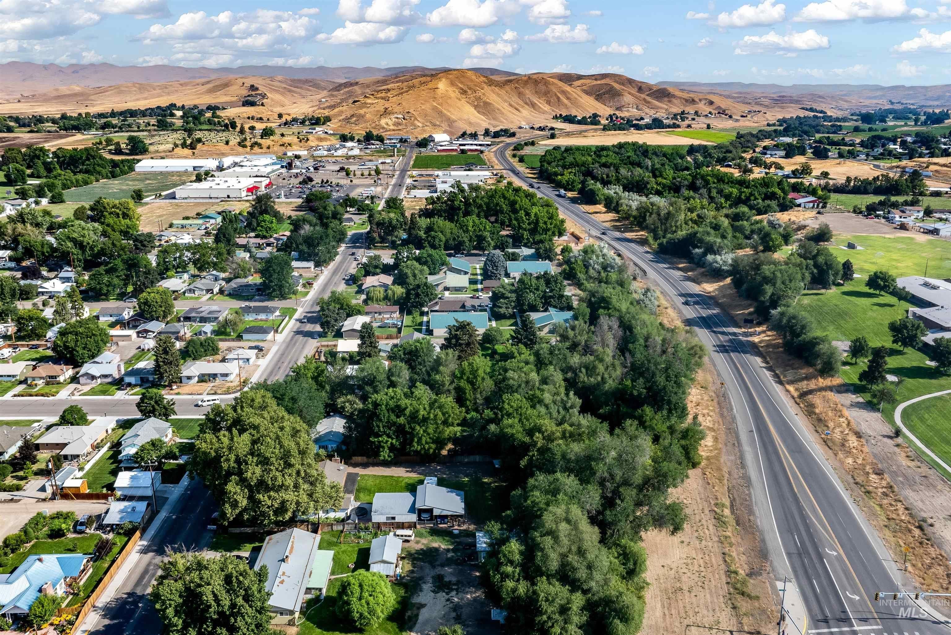 weiser idaho aerial view of the main road lush green trees and homes